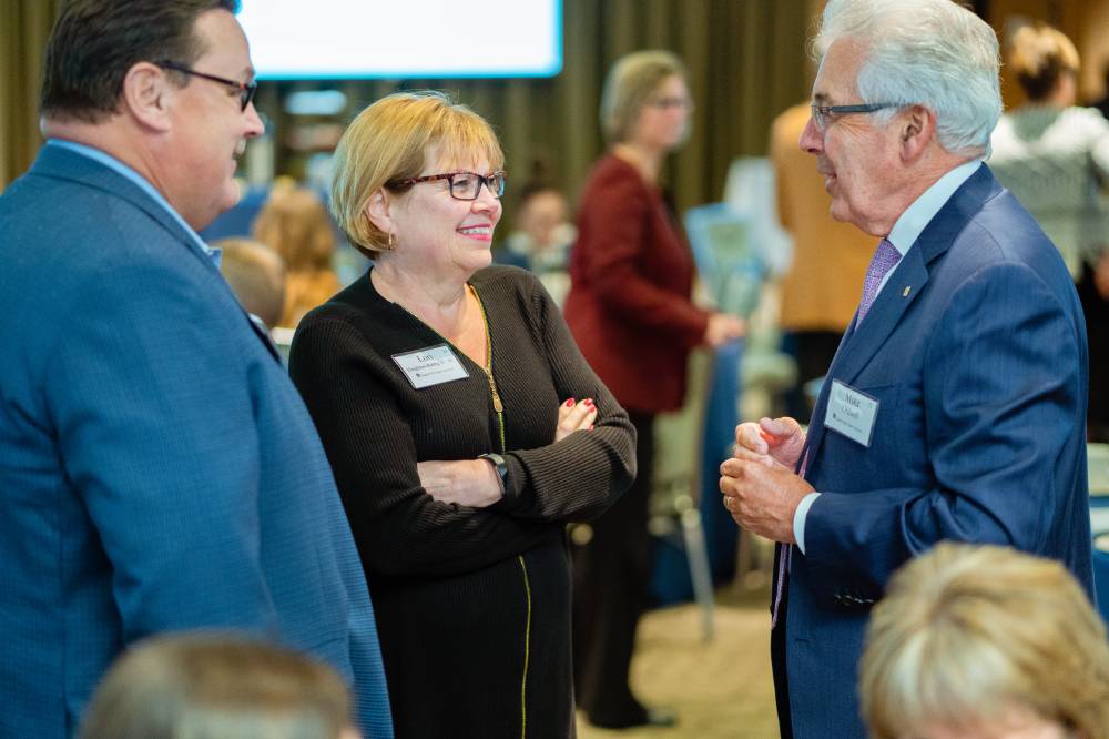 Donors standing and talking at Scholarship Dinner 2019